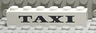 Brick 1 x 6 with Black 'TAXI' Thick Pattern