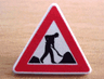 Road Sign 2 x 2 Triangle with Clip with Road Repair Worker and 2 Piles Pattern