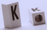 Tile, Modified 1 x 2 x 5/6 Stud Hole in End with Black Capital Letter K Pattern