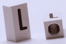 Tile, Modified 1 x 2 x 5/6 Stud Hole in End with Black Capital Letter L Pattern