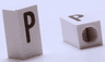 Tile, Modified 1 x 2 x 5/6 Stud Hole in End with Black Capital Letter P Pattern