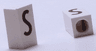 Tile, Modified 1 x 2 x 5/6 Stud Hole in End with Black Capital Letter S Pattern