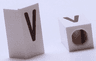 Tile, Modified 1 x 2 x 5/6 Stud Hole in End with Black Capital Letter V Pattern