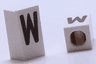 Tile, Modified 1 x 2 x 5/6 Stud Hole in End with Black Capital Letter W Pattern
