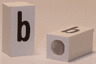 Tile, Modified 1 x 2 x 5/6 Stud Hole in End with Black Lowercase Letter b Pattern