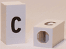 Tile, Modified 1 x 2 x 5/6 Stud Hole in End with Black Lowercase Letter c Pattern