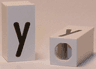 Tile, Modified 1 x 2 x 5/6 Stud Hole in End with Black Lowercase Letter y Pattern