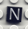 Tile 1 x 1 with Silver Capital Letter N Pattern