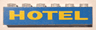 Brick 1 x 6 without Bottom Tubes with Yellow 'HOTEL' on Blue Background Pattern