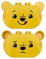 Duplo, Brick 2 x 4 x 2 1/2 Rounded Ends, Ears on Sides with Black Eyebrows, Eyes, Nose, and Mouth, Lopsided Grin with Red Tongue Sticking Out / Sad Pattern (Winnie the Pooh Head)