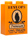 Brick 1 x 2 x 2 with Inside Stud Holder with Black 'EEYLOPS', 'Premium', 'OWL TREATS' and Owl Silhouette on Tan Background Pattern