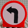 Duplo, Brick 1 x 2 x 2 Round Top with Black Left Turn Arrow on White Background Pattern