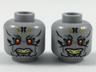 Minifigure, Head Dual Sided Alien with Red Eyes, Gold and Black Tattoos, Neutral / Faint Smile Pattern
