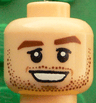 Minifigure, Head Reddish Brown Thick Eyebrows and Stubble, Black Eyelids, Medium Nougat Dimples, Open Mouth Smile with Teeth Pattern